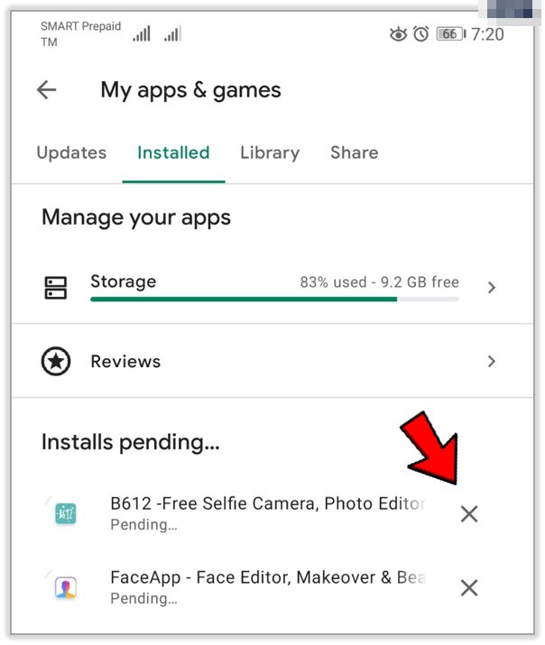 Detener otras descargas para solucionar problema de actualización de Play Store atascada